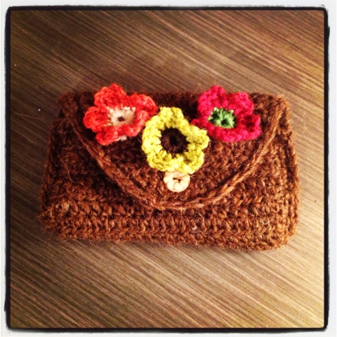 Crocheted pouch with flowers