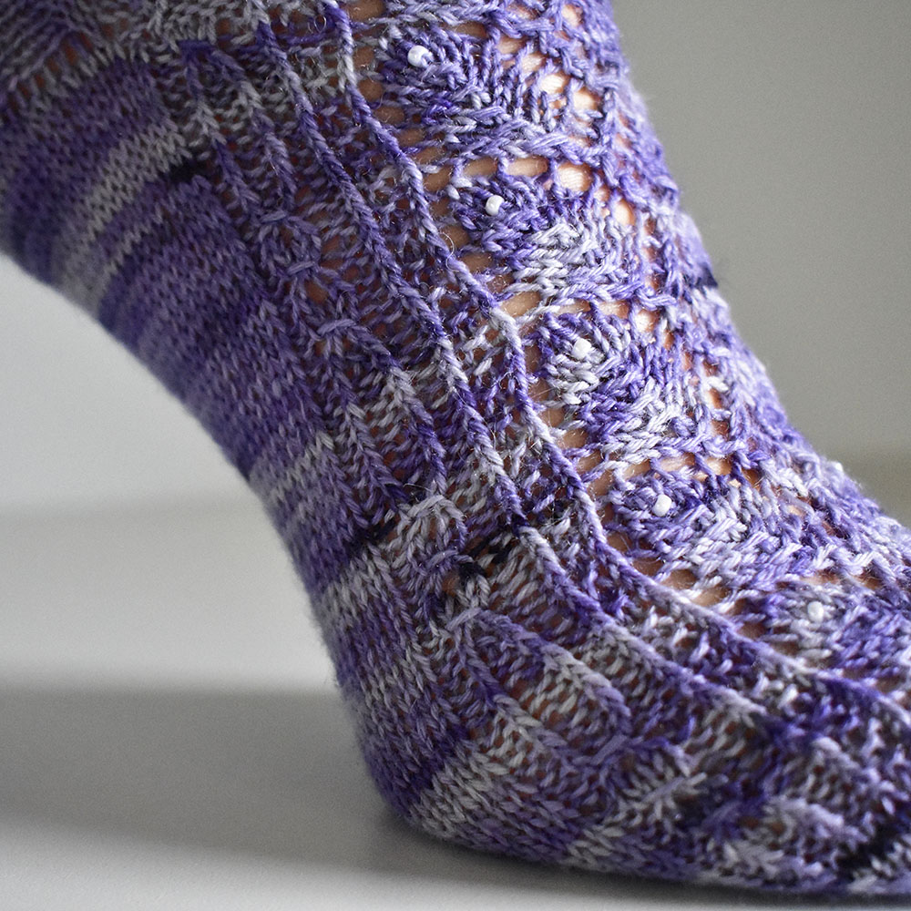 Elvenpath socks by Dots Dabbles with cables and lace
