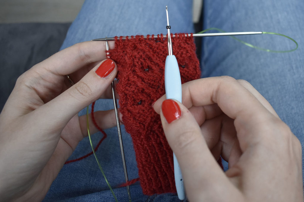 How to add beads to your knitting with a crochet hook - Dots Dabbles Designs