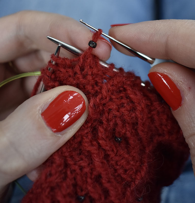 How to add beads to your knitting with a crochet hook