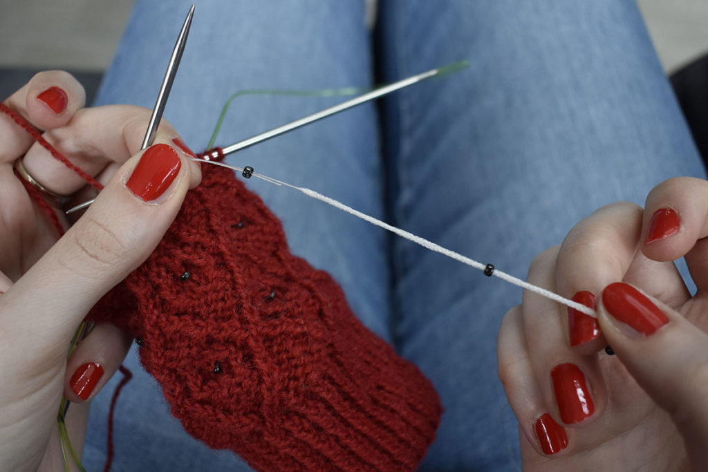 How to add beads to your knitting with a crochet hook - Dots Dabbles Designs